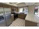 Updated kitchen featuring stainless steel appliances and tiled countertops and flooring at 10190 N 106Th E St, Scottsdale, AZ 85258