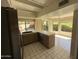 Well-lit kitchen featuring tiled floors and countertops, modern appliances, and ample storage at 10190 N 106Th E St, Scottsdale, AZ 85258