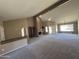Expansive living room featuring vaulted ceilings and large windows with natural light at 10190 N 106Th E St, Scottsdale, AZ 85258