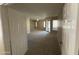 Spacious living room with plush carpeting and large windows providing ample natural light at 10190 N 106Th E St, Scottsdale, AZ 85258