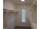 Walk-in closet with ample shelving and storage solutions, providing organized space at 10190 N 106Th E St, Scottsdale, AZ 85258