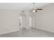 Empty bedroom featuring tile floors and views of another room through the doorway at 10367 E Wood Dr, Scottsdale, AZ 85260
