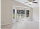 A bright, empty bedroom featuring tile floors and large windows offering natural light at 10367 E Wood Dr, Scottsdale, AZ 85260