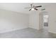An empty bedroom with tile flooring and an attached bathroom entrance at 10367 E Wood Dr, Scottsdale, AZ 85260