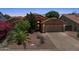 Charming single-Gathering home featuring a spacious two-car garage and low maintenance landscaping at 10367 E Wood Dr, Scottsdale, AZ 85260