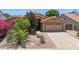 Inviting single-story home featuring a well-manicured desert front yard and two-car garage at 10367 E Wood Dr, Scottsdale, AZ 85260