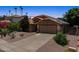 Beautiful home boasting a two-car garage, well-maintained landscaping, and solar panels at 10367 E Wood Dr, Scottsdale, AZ 85260