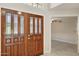 Welcoming foyer boasts a decorative glass front door and tiled flooring at 10367 E Wood Dr, Scottsdale, AZ 85260