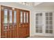Welcoming foyer boasts a decorative glass front door and tiled flooring at 10367 E Wood Dr, Scottsdale, AZ 85260