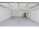 Spacious garage with ample storage space, water heater, and utility sink; ready for your projects at 10367 E Wood Dr, Scottsdale, AZ 85260