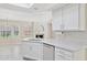 Well-designed kitchen with granite countertops, stainless steel appliances, and a view into the living area at 10367 E Wood Dr, Scottsdale, AZ 85260