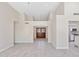 Spacious living room with tiled floors, arched entryways and high ceilings at 10367 E Wood Dr, Scottsdale, AZ 85260