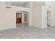 Spacious living room featuring tile flooring, high ceilings and arched doorways at 10367 E Wood Dr, Scottsdale, AZ 85260