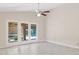 Bright living room with patio doors that lead to a private pool and outdoor living area at 10367 E Wood Dr, Scottsdale, AZ 85260