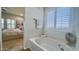 Bright bathroom showcasing a garden tub and shutters at 10850 W Avenida Del Rey --, Peoria, AZ 85383