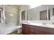 Tidy bathroom features a shower-tub combo and wooden vanity at 10850 W Avenida Del Rey --, Peoria, AZ 85383