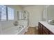Bright bathroom showcasing a garden tub, walk-in shower, and double vanity at 10850 W Avenida Del Rey --, Peoria, AZ 85383