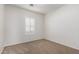 This bedroom features neutral walls, carpet flooring, and a window shutter at 10850 W Avenida Del Rey --, Peoria, AZ 85383