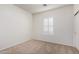 This bedroom features neutral walls, carpet flooring, and a window shutter at 10850 W Avenida Del Rey --, Peoria, AZ 85383