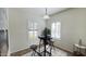 Bright breakfast nook area with a modern table set, plantation shutters and natural light at 10850 W Avenida Del Rey --, Peoria, AZ 85383