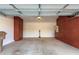 Spacious garage with ample storage cabinets, an electric vehicle charger, and a clean epoxy floor at 10850 W Avenida Del Rey --, Peoria, AZ 85383