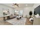 Bright and airy living room with stylish decor, a ceiling fan, and neutral colors at 10850 W Avenida Del Rey --, Peoria, AZ 85383