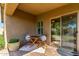 Charming covered patio with a table and chairs, creating a cozy outdoor seating area at 10850 W Avenida Del Rey --, Peoria, AZ 85383