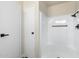 Bathroom equipped with a walk-in shower featuring matte black fixtures and a grab bar at 11411 N 91St Ave Ave # 87, Peoria, AZ 85345
