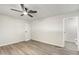 A minimalist bedroom is illuminated by a ceiling fan and an open ensuite bathroom at 11411 N 91St Ave Ave # 87, Peoria, AZ 85345