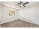Neutral bedroom with a ceiling fan, natural light, and hardwood flooring at 11411 N 91St Ave Ave # 87, Peoria, AZ 85345