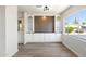 Bright dining room with custom built-ins, wood accent wall, and large window with view at 11411 N 91St Ave Ave # 87, Peoria, AZ 85345