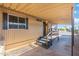 Welcoming covered patio area with steps leading to the entrance of the single story home at 11411 N 91St Ave Ave # 87, Peoria, AZ 85345