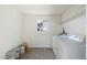 Laundry room featuring a full-size washer and dryer set, complemented by overhead shelving at 11411 N 91St Ave Ave # 87, Peoria, AZ 85345