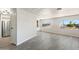 Open-concept living room features modern flooring, white walls, and plenty of natural light at 11411 N 91St Ave Ave # 87, Peoria, AZ 85345