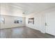 Bright, airy living room features modern floors, white walls, and large windows for outdoor views at 11411 N 91St Ave Ave # 87, Peoria, AZ 85345
