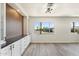 Open living area showcasing a window, built-in cabinetry, and neutral decor at 11411 N 91St Ave Ave # 87, Peoria, AZ 85345