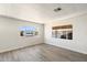 Bright living room with light gray vinyl floors and large windows offering community views at 11411 N 91St Ave Ave # 87, Peoria, AZ 85345