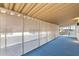 Enclosed patio with screens and blue carpet offers relaxing outdoor living space at 11411 N 91St Ave Ave # 87, Peoria, AZ 85345