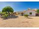 Large backyard area with a covered patio and potential for landscaping or recreation at 1213 W Beck Ln, Phoenix, AZ 85023
