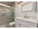Modern bathroom features a glass-enclosed shower, updated fixtures, and a stylish vanity with great lighting at 1213 W Beck Ln, Phoenix, AZ 85023