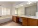 Bright bathroom features a double vanity, soaking tub, and great lighting at 1213 W Beck Ln, Phoenix, AZ 85023