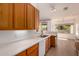 Well-maintained kitchen with plenty of counter space and sleek, wood cabinetry for storage at 1213 W Beck Ln, Phoenix, AZ 85023