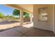 Covered patio with concrete flooring and supports, overlooking a spacious, fenced backyard at 1213 W Beck Ln, Phoenix, AZ 85023