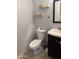 Cozy bathroom featuring a toilet, vanity with sink, and neutral wall color at 1342 W Emerald Ave # 373, Mesa, AZ 85202