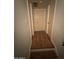 Inviting hallway with beautiful wood-look floors leading to various rooms at 1342 W Emerald Ave # 373, Mesa, AZ 85202