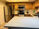 Modern kitchen features stainless steel appliances and countertop at 1342 W Emerald Ave # 373, Mesa, AZ 85202