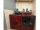 Spacious laundry room featuring red washer and dryer units and ample shelving at 1342 W Emerald Ave # 373, Mesa, AZ 85202