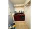 Bright laundry area with tile floor, Whirlpool washer/dryer, shelving and laundry supplies at 1342 W Emerald Ave # 373, Mesa, AZ 85202
