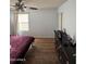 Bedroom with ample natural light, wood-look flooring, ceiling fan, and closet at 1342 W Emerald Ave # 373, Mesa, AZ 85202