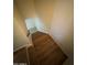 Staircase with wooden steps and tile landing, providing access to upper floors at 1342 W Emerald Ave # 373, Mesa, AZ 85202